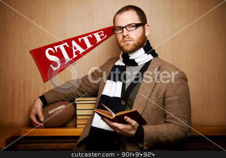 Young college man with books & ball Young college man with books & ball stock photo, A young male college student set against a wood background holding his school textbooks and his football. by Kelli Harmon