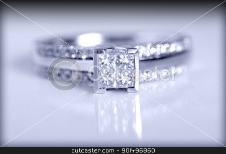 To use this stock image in your creative project, please select the size you need over to the right and click the "Add to Cart" button.
Your downloaded image will come with the Cutcaster watermark removed so don’t worry about the watermark you see on this page. Engagement Ring stock photo, Closeup shot of a diamond engagement ring shot on a grey background. by Richard Nelson