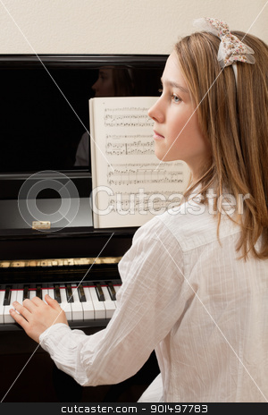 To use this stock image in your creative project, please select the size you need over to the right and click the "Add to Cart" button.
Your downloaded image will come with the Cutcaster watermark removed so don’t worry about the watermark you see on this page. Piano practice stock photo, Photo of a young girl playing the piano at home. by © Ron Sumners