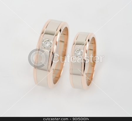 To use this stock image in your creative project, please select the size you need over to the right and click the "Add to Cart" button.
Your downloaded image will come with the Cutcaster watermark removed so don’t worry about the watermark you see on this page. two gold rings stock photo, Celebratory accessories - two gold rings for wedding day by olinchuk