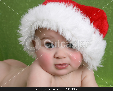Christmas Baby Christmas Baby stock photo, Cute baby boy wearing a christmas hat on green background by Vanessa Van Rensburg
