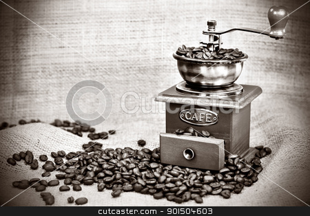 Vintage coffee mill Vintage coffee mill stock photo, Contrast black&white image of vintage coffee mill or grinder with coffee beans .Dramatic lightning by borojoint