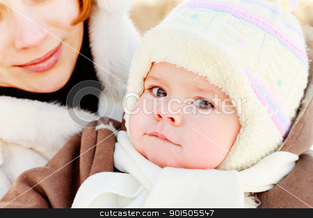 Mother with baby outdoor Mother with baby outdoor stock photo, Woman with baby on her hand in winter by Oleg