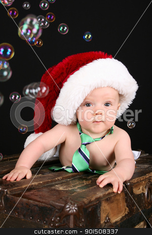 Christmas Bubbles Christmas Bubbles stock photo, Cute christmas baby boy sitting on an antique trunk by Vanessa Van Rensburg