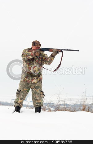 Hunter aiming Hunter aiming stock photo, Male hunter in camouflage aiming at his target or prey with his gun.Winter scene by borojoint