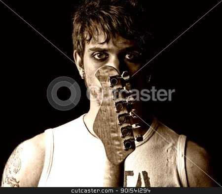 To use this stock image in your creative project, please select the size you need over to the right and click the "Add to Cart" button.
Your downloaded image will come with the Cutcaster watermark removed so don’t worry about the watermark you see on this page. Young man with guitar portrait grunge punk rock stock photo, Young man with guitar portrait grunge punk rock by Daniel Garcia Mata