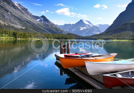To use this stock image in your creative project, please select the size you need over to the right and click the "Add to Cart" button.
Your downloaded image will come with the Cutcaster watermark removed so don’t worry about the watermark you see on this page. Glacier National park stock photo, Canoes by lake Mc Donald in Glacier national park by Sreedhar Yedlapati
