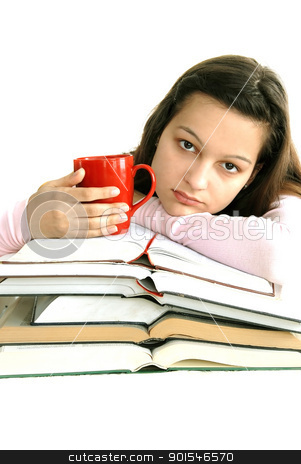 Teenage girl with books and tea Teenage girl with books and tea stock photo, caucasian teenage girl sitting at the desk with stack of opened books and tea cup by Julija Sapic