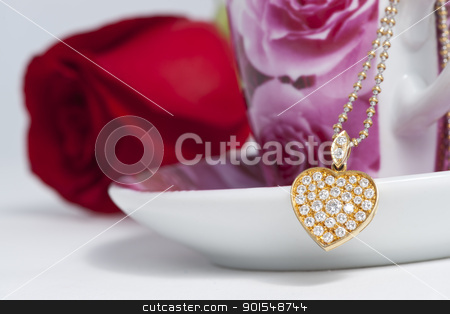To use this stock image in your creative project, please select the size you need over to the right and click the "Add to Cart" button.
Your downloaded image will come with the Cutcaster watermark removed so don’t worry about the watermark you see on this page. Diamond heart shape pendant and red rose stock photo, Diamond heart shape pendant and red rose by pixs4u