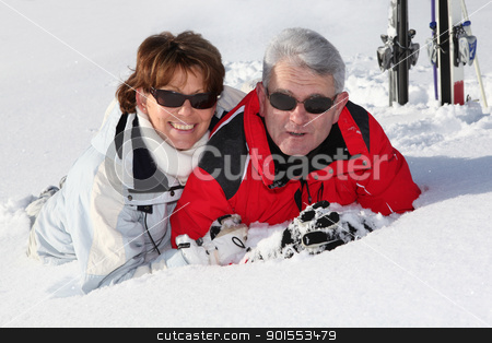 To use this stock image in your creative project, please select the size you need over to the right and click the "Add to Cart" button.
Your downloaded image will come with the Cutcaster watermark removed so don’t worry about the watermark you see on this page. Older couple lying in the snow stock photo, Older couple lying in the snow by photography33