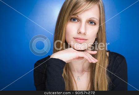 To use this stock image in your creative project, please select the size you need over to the right and click the "Add to Cart" button.
Your downloaded image will come with the Cutcaster watermark removed so don’t worry about the watermark you see on this page. Graceful friendly young blond woman. stock photo, Portrait of a graceful friendly young blond woman on blue background. by exvivo