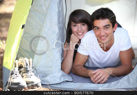 To use this stock image in your creative project, please select the size you need over to the right and click the "Add to Cart" button.
Your downloaded image will come with the Cutcaster watermark removed so don’t worry about the watermark you see on this page. Teenage couple in a tent stock photo, Teenage couple in a tent by photography33