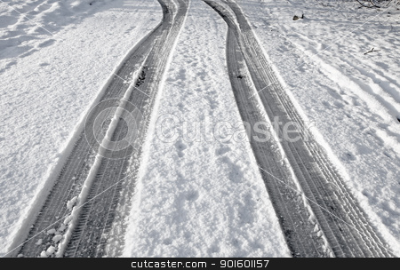 Close up tyre tracks in snow on a road. Close up tyre tracks in snow on a road. stock photo, Close up tyre tracks in snow on a road. by Stephen Rees