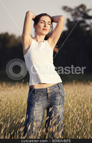 To use this stock image in your creative project, please select the size you need over to the right and click the "Add to Cart" button.
Your downloaded image will come with the Cutcaster watermark removed so don’t worry about the watermark you see on this page. Relaxing on a summer day stock photo, Outdoor portrait of a woman on a meadow releaxing by ikostudio