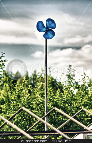 Blue Garden Windmill Blue Garden Windmill stock photo, blue garden windmill against cloudy sky at summer day by Petr Malyshev