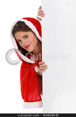 To use this stock image in your creative project, please select the size you need over to the right and click the "Add to Cart" button.
Your downloaded image will come with the Cutcaster watermark removed so don’t worry about the watermark you see on this page. Miss Santa peeking round a board left blank for your message stock photo, Miss Santa peeking round a board left blank for your message by photography33