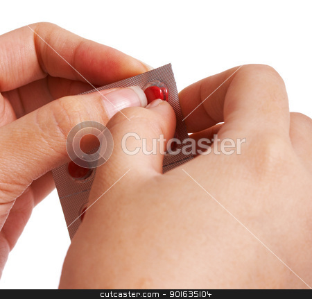 Removing A Pill From Its Packet Removing A Pill From Its Packet stock photo, Removing A Pill From Its Packet To Treat Medical Problem by stuartmiles