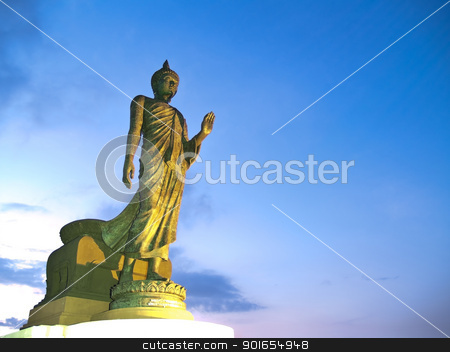 To use this stock image in your creative project, please select the size you need over to the right and click the "Add to Cart" button.
Your downloaded image will come with the Cutcaster watermark removed so don’t worry about the watermark you see on this page. Walking Buddha image stock photo, Walking Buddha image in Vitarka Mudra posture illuminate with spotlight at twilight time, Buddhamonthon, Nakhon Pathom, Thailand by Exsodus