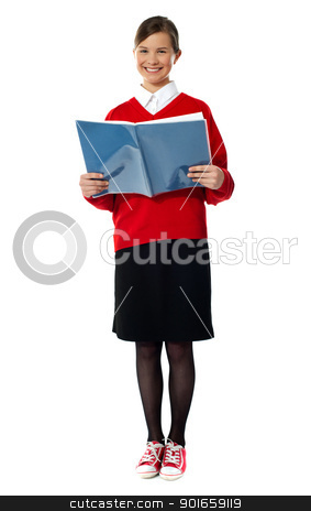 Smiling girl standing with exercise book Smiling girl standing with exercise book stock photo, Caucasian smiling student girl standing with exercise book by Ishay Botbol