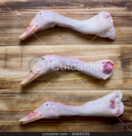 To use this stock image in your creative project, please select the size you need over to the right and click the "Add to Cart" button.
Your downloaded image will come with the Cutcaster watermark removed so don’t worry about the watermark you see on this page. duck heads stock photo, close up of duck heads on table by zkruger
