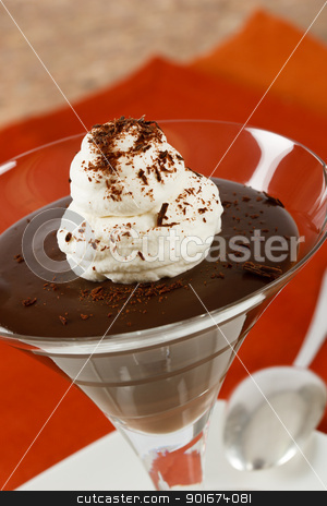 To use this stock image in your creative project, please select the size you need over to the right and click the "Add to Cart" button.
Your downloaded image will come with the Cutcaster watermark removed so don’t worry about the watermark you see on this page. Chocolate Pudding Close Up stock photo, Close up of creamy chocolate pudding with whipped cream and chocolate shavings by Karen Sarraga