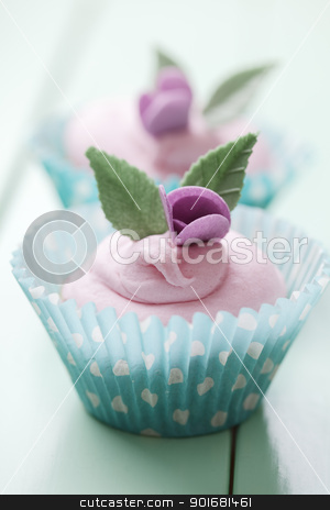 To use this stock image in your creative project, please select the size you need over to the right and click the "Add to Cart" button.
Your downloaded image will come with the Cutcaster watermark removed so don’t worry about the watermark you see on this page. Pastel cupcakes stock photo, closeup of beautiful summer cupcake with strawberry flavoured cream by Liv Friis-Larsen