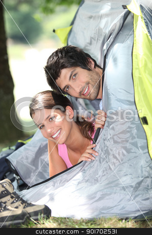 To use this stock image in your creative project, please select the size you need over to the right and click the "Add to Cart" button.
Your downloaded image will come with the Cutcaster watermark removed so don’t worry about the watermark you see on this page. Young couple sticking their heads out of a tent door stock photo, Young couple sticking their heads out of a tent door by photography33
