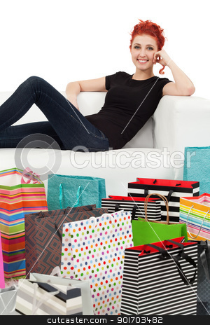 Young female and shopping bags Young female and shopping bags stock photo, A happy shopping girl sitting on a white couch surrounded with shopping bags.
by © Ron Sumners