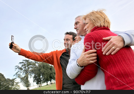 To use this stock image in your creative project, please select the size you need over to the right and click the "Add to Cart" button.
Your downloaded image will come with the Cutcaster watermark removed so don’t worry about the watermark you see on this page. Family taking their own picture with a phone stock photo, Family taking their own picture with a phone by photography33