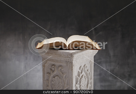 To use this stock image in your creative project, please select the size you need over to the right and click the "Add to Cart" button.
Your downloaded image will come with the Cutcaster watermark removed so don’t worry about the watermark you see on this page. Open Book stock photo, Old book opened on a plaster column. by Stocksnapper