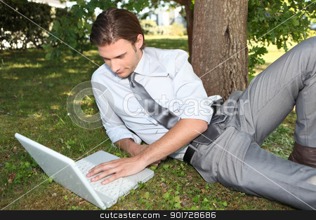 To use this stock image in your creative project, please select the size you need over to the right and click the "Add to Cart" button.
Your downloaded image will come with the Cutcaster watermark removed so don’t worry about the watermark you see on this page. Businessman working outside on laptop stock photo, Businessman working outside on laptop by photography33