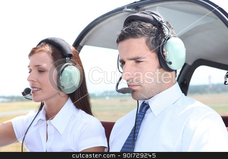 Man and woman in a light aircraft Man and woman in a light aircraft stock photo, Man and woman in a light aircraft by photography33