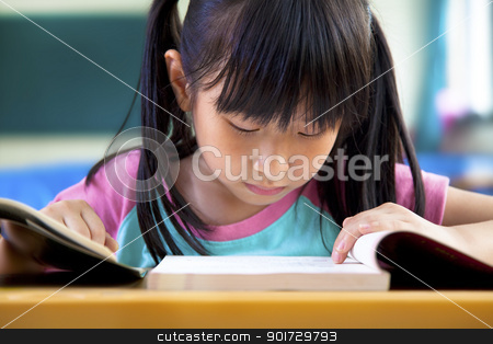 Little girl studying in classroom at school little girl studying in classroom at school stock photo, little girl studying in classroom at school by tomwang