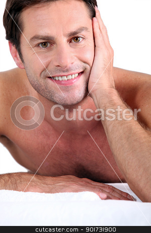 To use this stock image in your creative project, please select the size you need over to the right and click the "Add to Cart" button.
Your downloaded image will come with the Cutcaster watermark removed so don’t worry about the watermark you see on this page. Naked man lying on massage table stock photo, Naked man lying on massage table by photography33