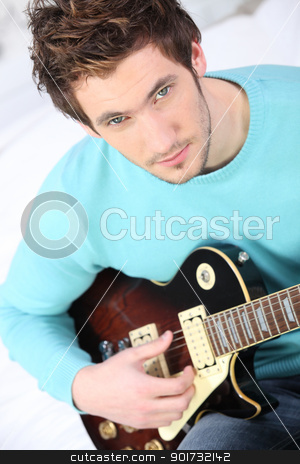 Blond boy playing guitar Blond boy playing guitar stock photo, Blond boy playing guitar by photography33