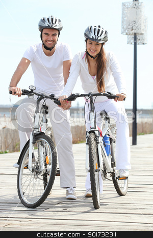 To use this stock image in your creative project, please select the size you need over to the right and click the "Add to Cart" button.
Your downloaded image will come with the Cutcaster watermark removed so don’t worry about the watermark you see on this page. couple riding bicycle wearing cycle helmet stock photo, couple riding bicycle wearing cycle helmet by photography33