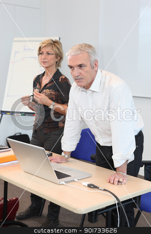 To use this stock image in your creative project, please select the size you need over to the right and click the "Add to Cart" button.
Your downloaded image will come with the Cutcaster watermark removed so don’t worry about the watermark you see on this page. Teacher in classroom with assistant stock photo, Teacher in classroom with assistant by photography33