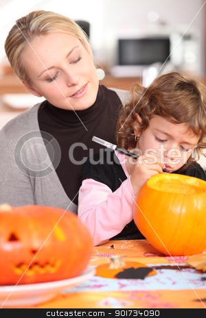 To use this stock image in your creative project, please select the size you need over to the right and click the "Add to Cart" button.
Your downloaded image will come with the Cutcaster watermark removed so don’t worry about the watermark you see on this page. Little girl carving out pumpkin for Halloween stock photo, Little girl carving out pumpkin for Halloween by photography33
