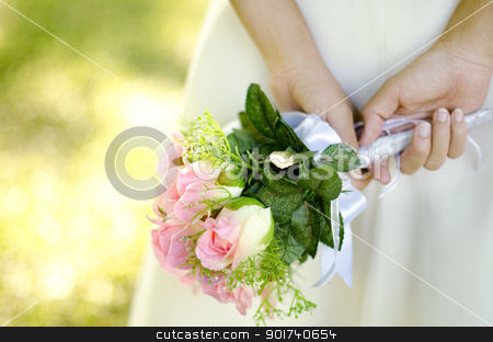 Bridal Bouquet Bridal Bouquet stock photo, Bride holding her bouquet behind her back by szefei