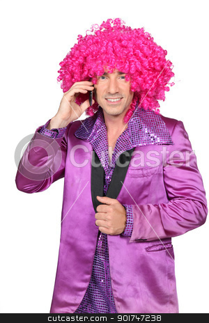 To use this stock image in your creative project, please select the size you need over to the right and click the "Add to Cart" button.
Your downloaded image will come with the Cutcaster watermark removed so don’t worry about the watermark you see on this page. Man in Seventies costume and crazy wig on cellphone stock photo, Man in Seventies costume and crazy wig on cellphone by photography33