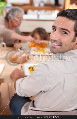 Family having meal in kitchen Family having meal in kitchen stock photo, Family having meal in kitchen by photography33
