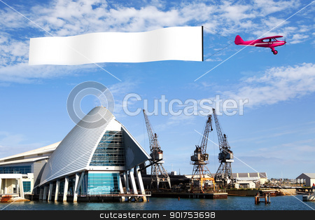 Plane and blank place Plane and blank place stock photo, Plane in the sky above the city with blank flag by Sergey Nivens