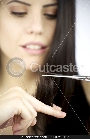 To use this stock image in your creative project, please select the size you need over to the right and click the "Add to Cart" button.
Your downloaded image will come with the Cutcaster watermark removed so don’t worry about the watermark you see on this page. Closeup of scissor cutting hair with beautiful female looking stock photo, Gorgeous female model with black hair cutting split dead ends by federico marsicano