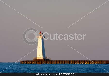 To use this stock image in your creative project, please select the size you need over to the right and click the "Add to Cart" button.
Your downloaded image will come with the Cutcaster watermark removed so don’t worry about the watermark you see on this page. Sodus Bay Lighthouse stock photo, Sodus Bay Lighthouse on Lake Ontario in evening light at sunset by Stephen Bonk