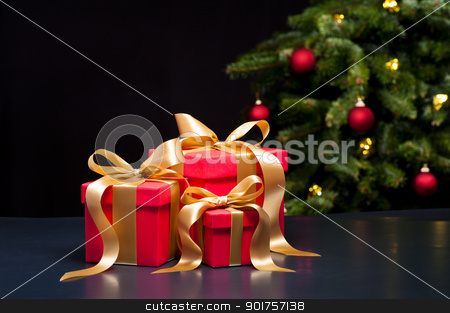 Three presents with gold ribbon Three presents with gold ribbon stock photo, Three presents with gold ribbon in an elegant Christmas setting by Ulrich Schade