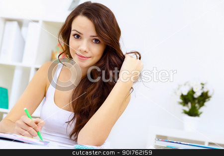 To use this stock image in your creative project, please select the size you need over to the right and click the "Add to Cart" button.
Your downloaded image will come with the Cutcaster watermark removed so don’t worry about the watermark you see on this page. Student girl stock photo, Student girl studying her lessons at home by Sergey Nivens