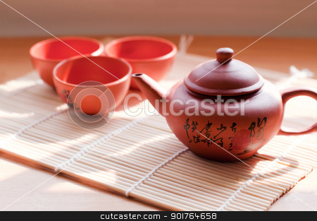 Chinese ceramic teapot and cups. Chinese ceramic teapot and cups. stock photo, Chinese ceramic teapot and cups. The Chinese word on the pot is a poem. by szefei