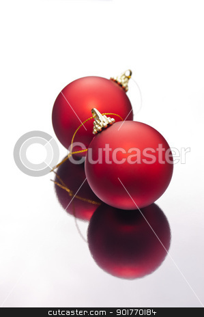 To use this stock image in your creative project, please select the size you need over to the right and click the "Add to Cart" button.
Your downloaded image will come with the Cutcaster watermark removed so don’t worry about the watermark you see on this page. Christmas baubles on a silver reflective surface stock photo, Red Christmas baubles on a silver reflective surface by Ulrich Schade