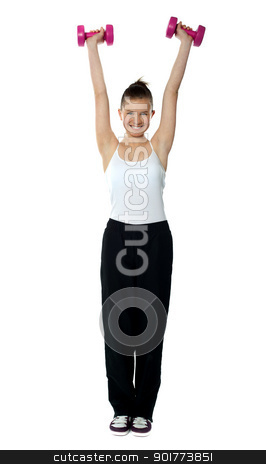 To use this stock image in your creative project, please select the size you need over to the right and click the "Add to Cart" button.
Your downloaded image will come with the Cutcaster watermark removed so don’t worry about the watermark you see on this page. Young girl exercising with dumbbells stock photo, Young girl exercising with dumbbells wearing sporty outfit by Ishay Botbol