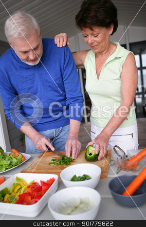 Older couple preparing a meal Older couple preparing a meal stock photo, Older couple preparing a meal by photography33